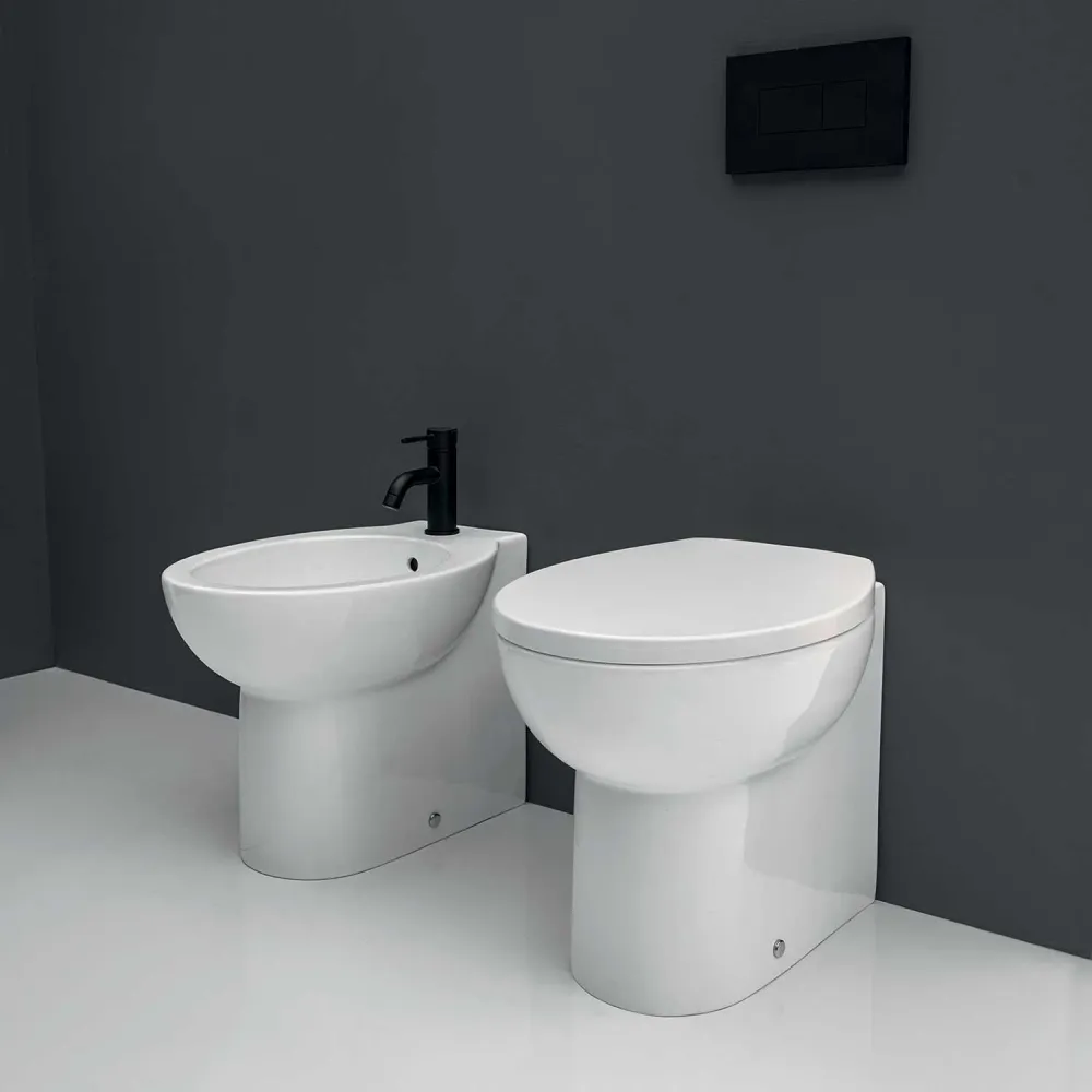 Floor-mounted wall-hugging sanitary ware Axa Prima collection wc + bidet + aaibaar close seat