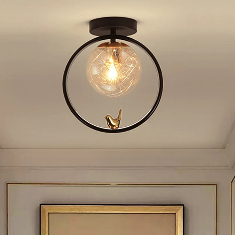Bolvormig semi-inbouwlicht eigentijds helder glas, enkele lamp, zwart plafondmontagearmatuur met wereldbol/vogeldecor Clea...