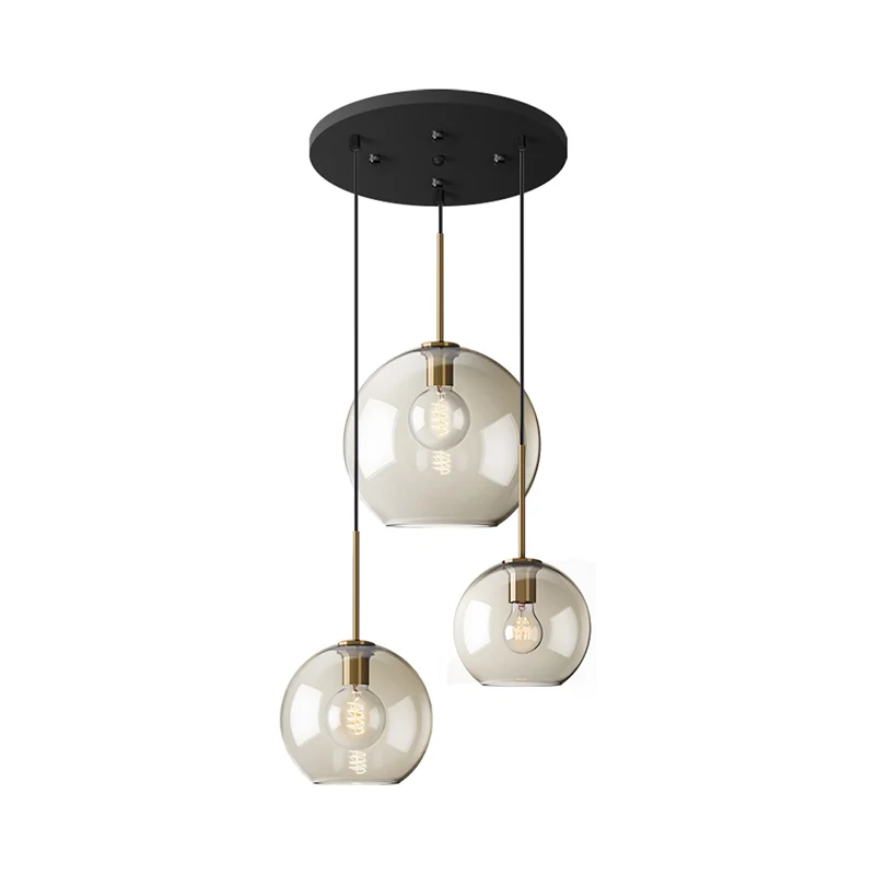 Eenvoudige hangverlichting met 3 lampen en amberkleurige glazen kap Zwarte ronde hanger met meerdere lampen Clearhalo