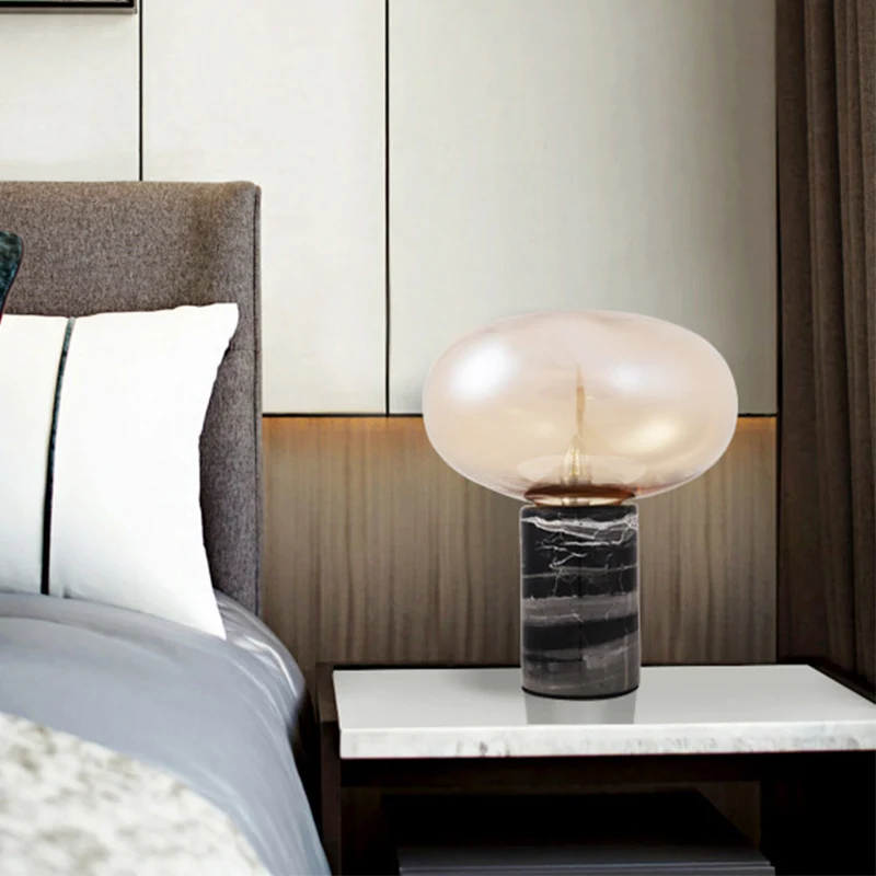 Ellipse woonkamertafellamp wit/amber glas enkele postmoderne nachtlamp met marmeren voetstuk zwart Clearhalo