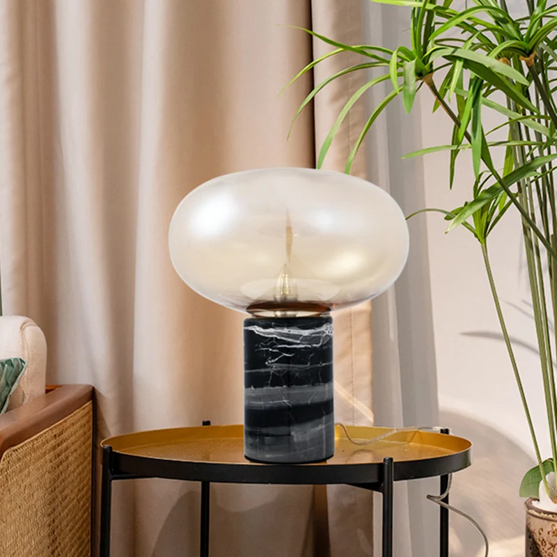 Ellipse woonkamertafellamp wit/amber glas enkele postmoderne nachtlamp met marmeren voetstuk zwart Clearhalo