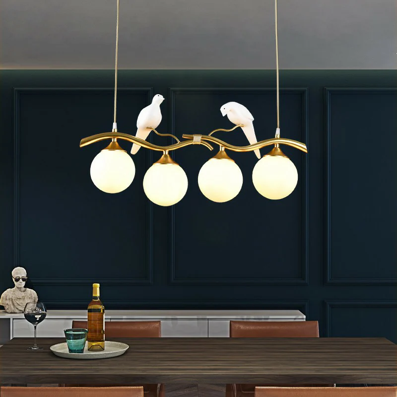Minimalistische Branch Island Lighting Metalen 4-lichts eetkamer hanglamp met bolglazen kap en vogeldeco Clearhalo