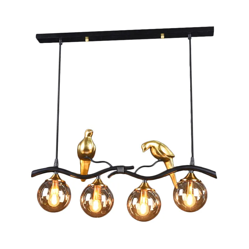 Takje Island hanglamp postmodern ijzer 4-lichts zwart/gouden hanglamp met amberkleurige bolglazen kap en vogeldeco Clearhalo