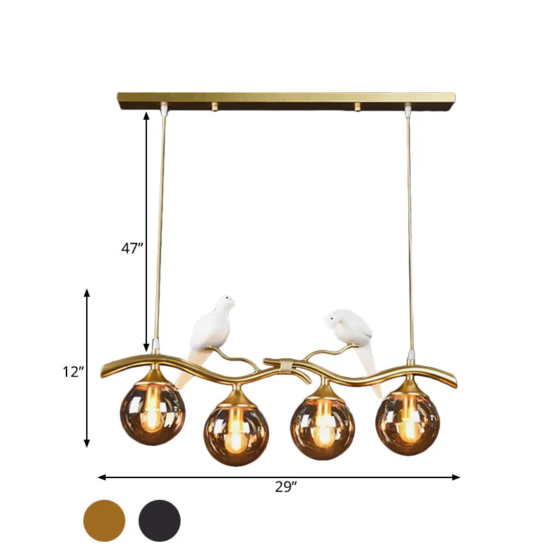 Takje Island hanglamp postmodern ijzer 4-lichts zwart/gouden hanglamp met amberkleurige bolglazen kap en vogeldeco Clearhalo