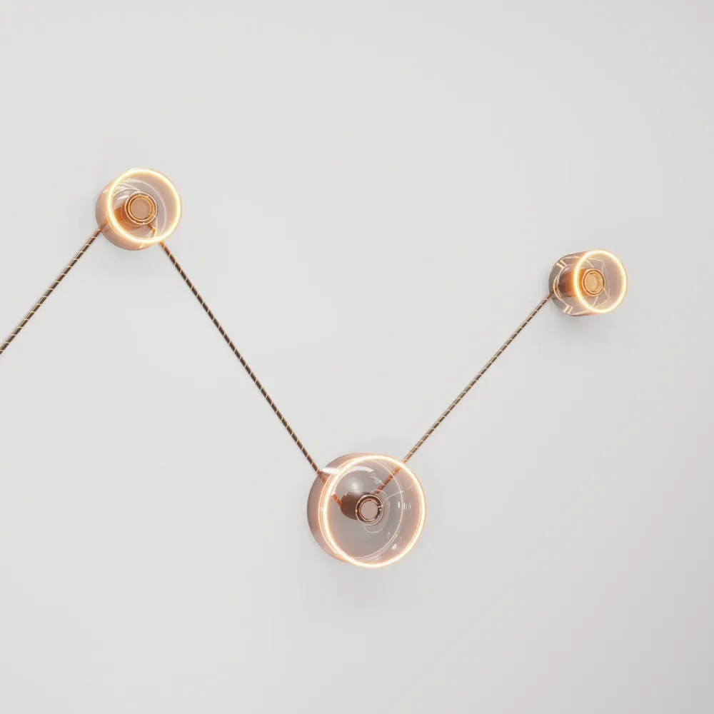 Wandlamp Spostaluce met 3 Ghost lichtbronnen en zwart-goud strijkijzersnoer